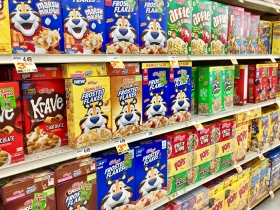 Grocery store shelves filled with sugary cereal